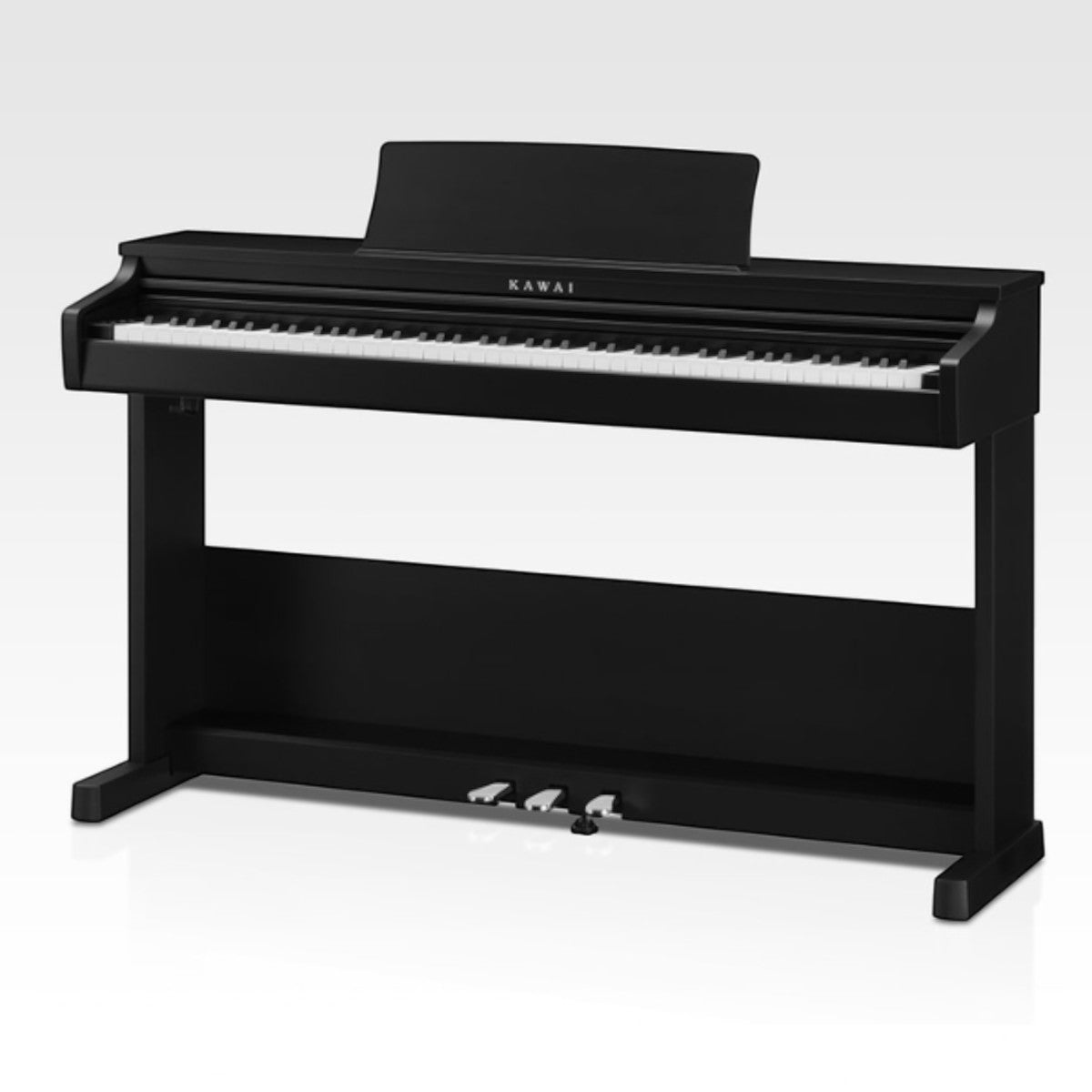 Đàn piano điện Kawai CX102 màu đen tại Tân Nhạc Cụ với thiết kế dáng tủ gọn gàng và cụm ba pedal gắn liền.