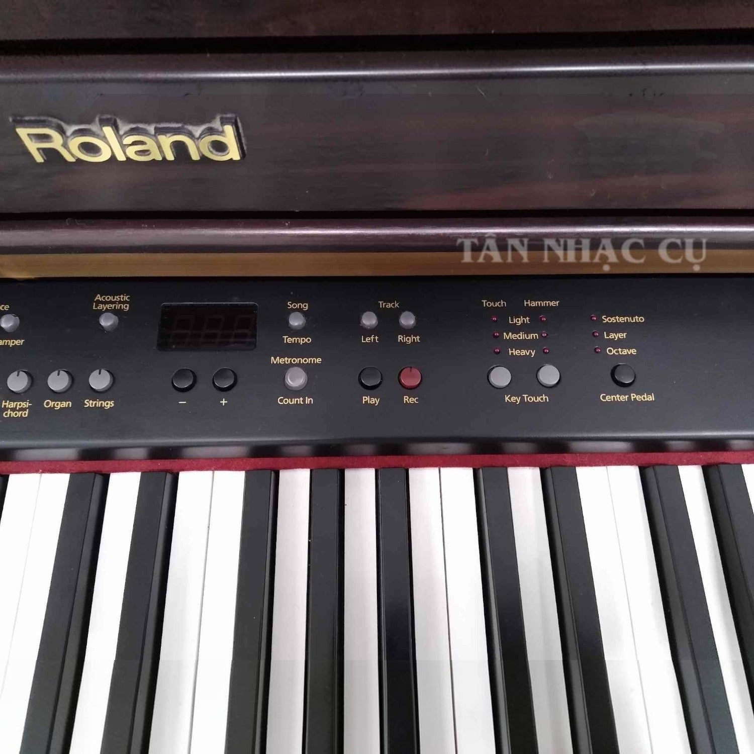 Bảng điều khiển đàn piano điện TÂN NHẠC CỤ Roland HP107 với các nút chức năng và phím đàn chi tiết