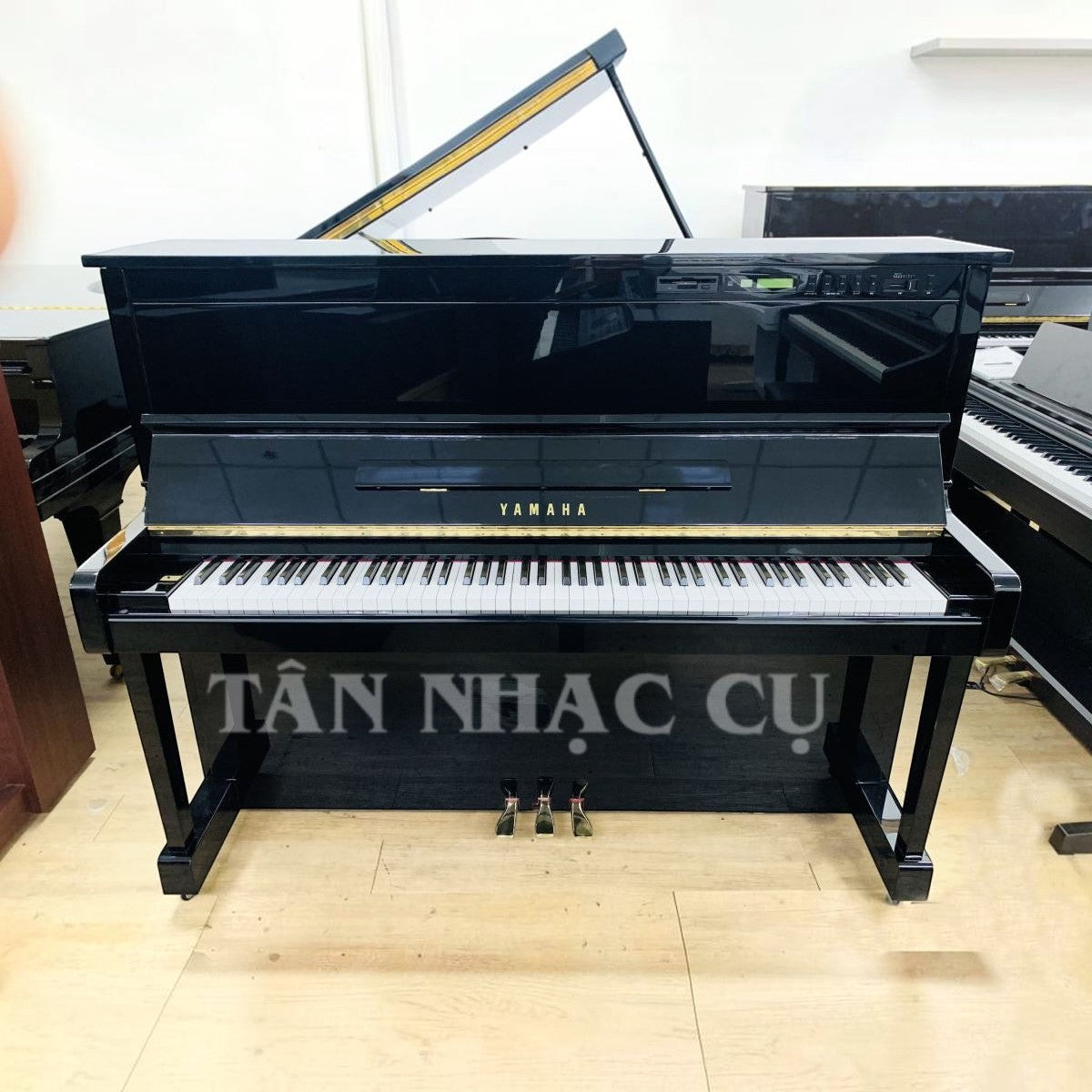 Đàn piano cơ Yamaha SX100RBL màu đen bóng sang trọng có tính năng tự chơi tại TÂN NHẠC CỤ